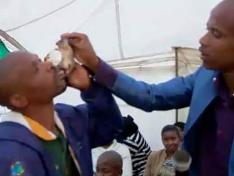 AFRICA- PASTOR PRAYS UNTIL MAN VOMITS OUT RAT