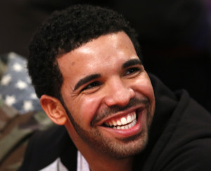 Canadian rap artist Drake sits courtside for the 2013 NBA All-Star basketball game in Houston, Texas, February 17, 2013.   REUTERS/Lucy Nicholson (UNITED STATES  - Tags: SPORT BASKETBALL ENTERTAINMENT)   - RTR3DXRQ